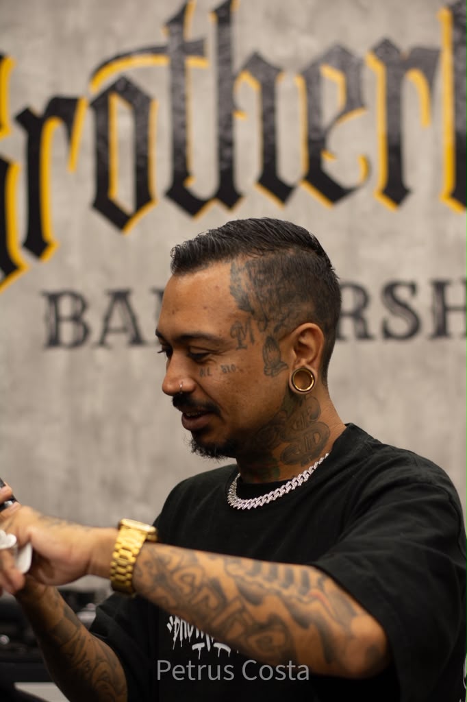 Master barber at work at Brotherhood Barbershop in Deerfield Beach, FL