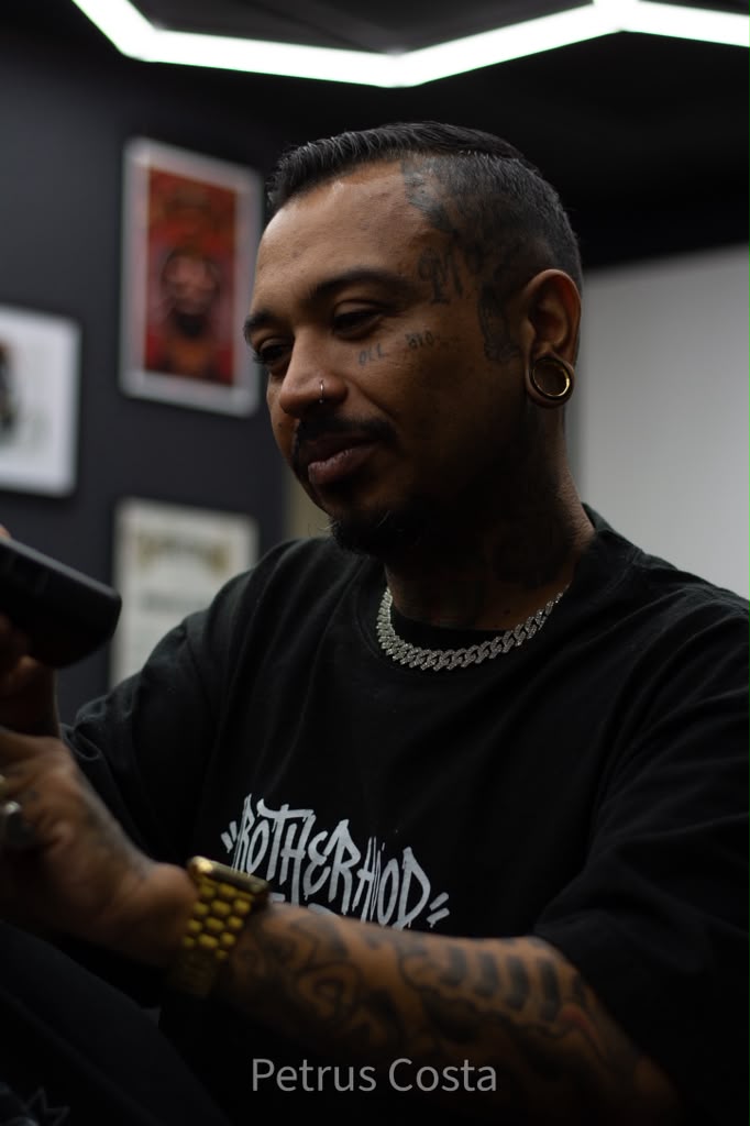 Master barber portrait inside Brotherhood Barbershop in Deerfield Beach, FL