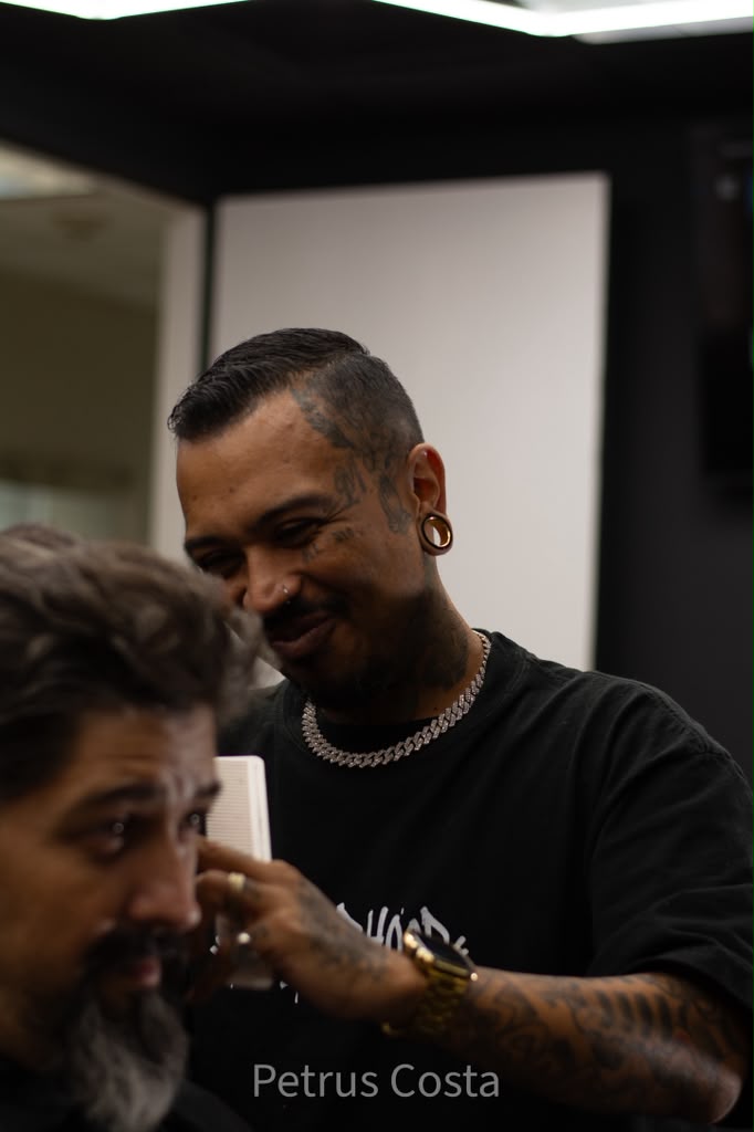 Barber detailing a client's beard at Brotherhood Barbershop in Deerfield Beach, FL