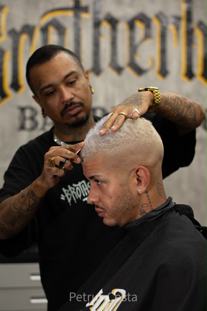 Platinum buzz cut in progress at Brotherhood Barbershop in Deerfield Beach, FL