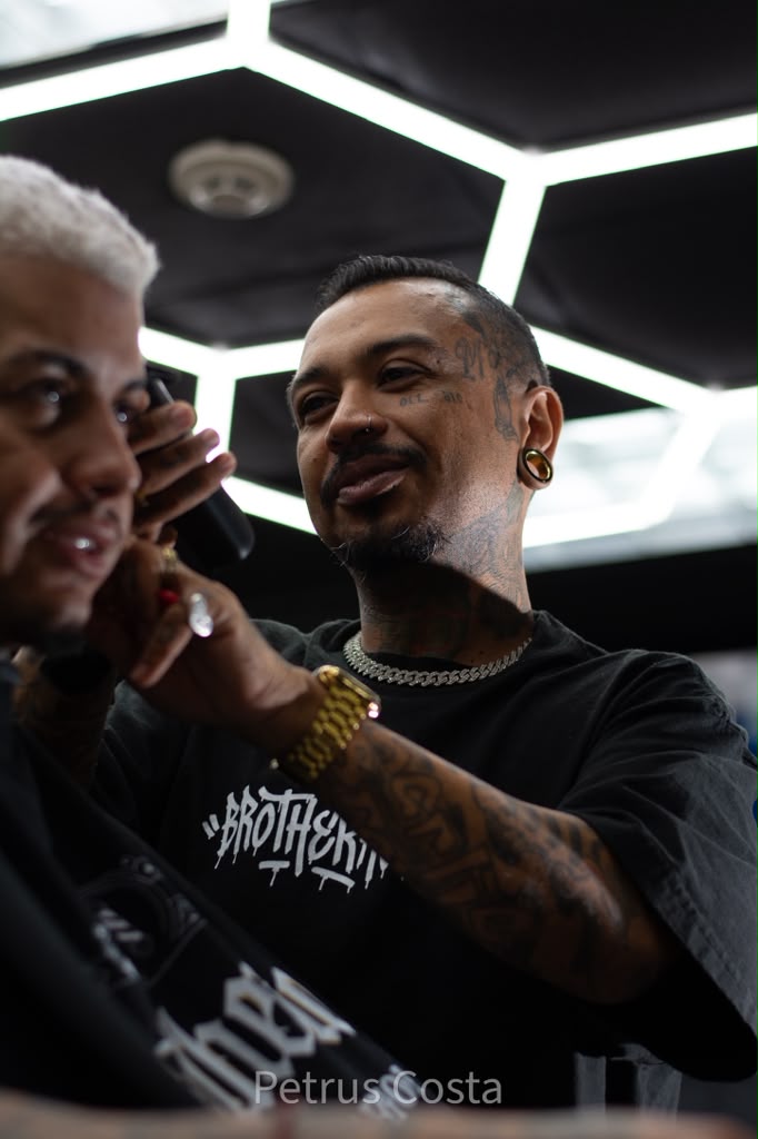 Barber finishing a platinum haircut at Brotherhood Barbershop in Deerfield Beach, FL